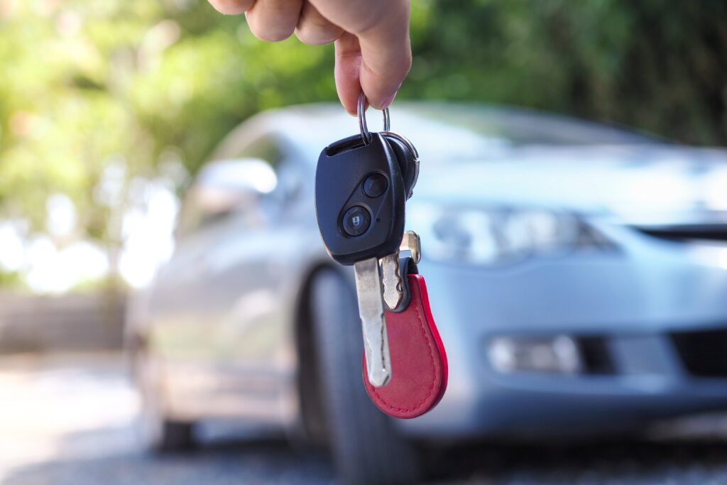 Fingers holding a set of car keys